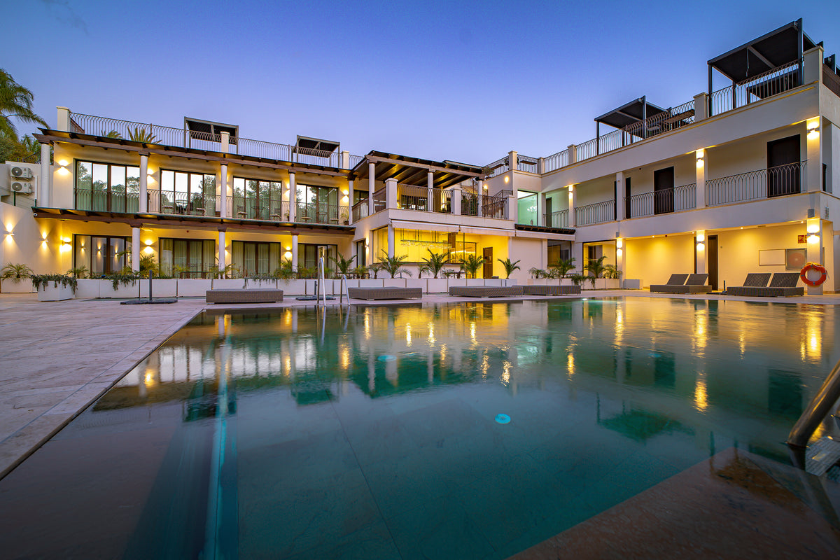 Oasis Premium Recovery private residence and pool at dusk in Marbella, Spain